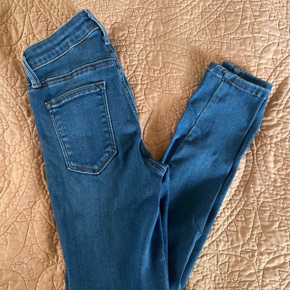 Woman’s Just Black dark denim jeans.